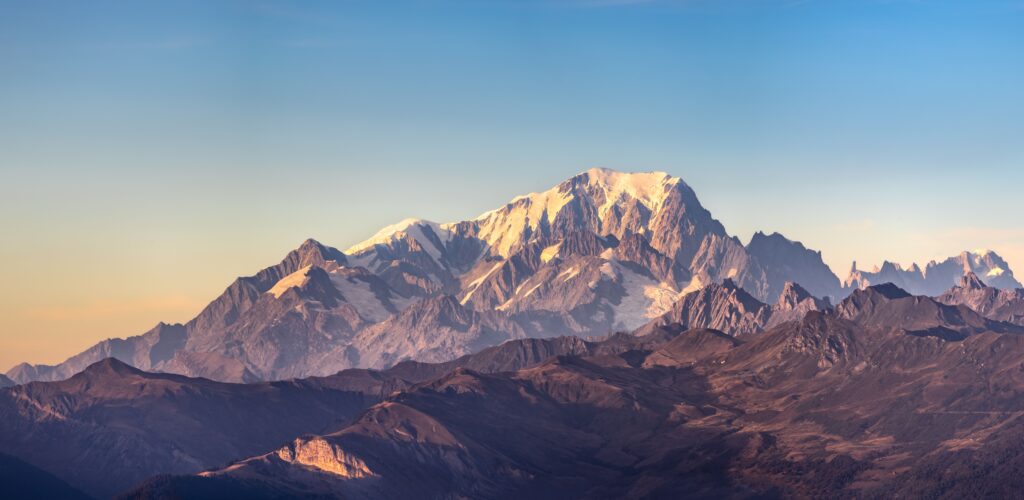 Breathtaking view of Mont Blanc during a sunny day showcasing majestic snow-capped peaks.